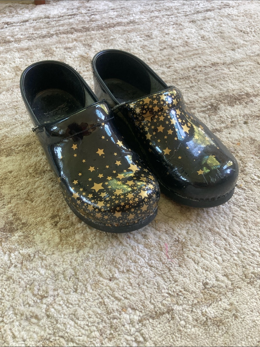 Womens dansko clogs black pattent with Gold Star Pattern